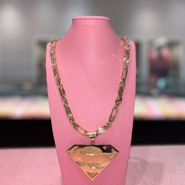 Large gold Superman shield pendant on Milano chain